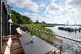 Uferhäuser auf Rügen im Naturhafen Gustow - Motorboot (optional)