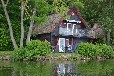 Ferienhaus Schweriner See mit Boot - Blaues Reetdachhaus