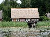 Bootshaus am Malchiner See mit Motorboot