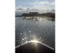 Bootshaus am Malchiner See mit Steg und Boot