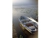 Bootshaus am Malchiner See mit Steg und Boot