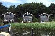 Uferhäuser auf Rügen im Naturhafen Gustow - Motorboot (optional)